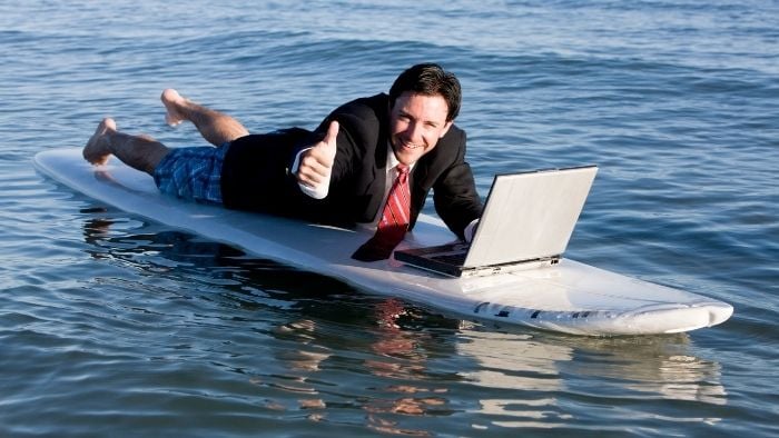 man surfing with laptop